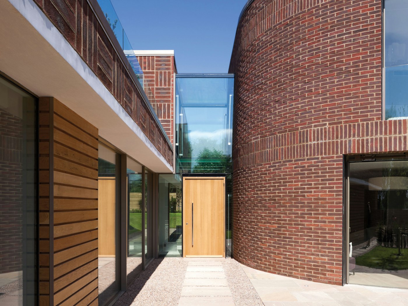 Rondo V Oak front door in a contemporary house with glass framing 