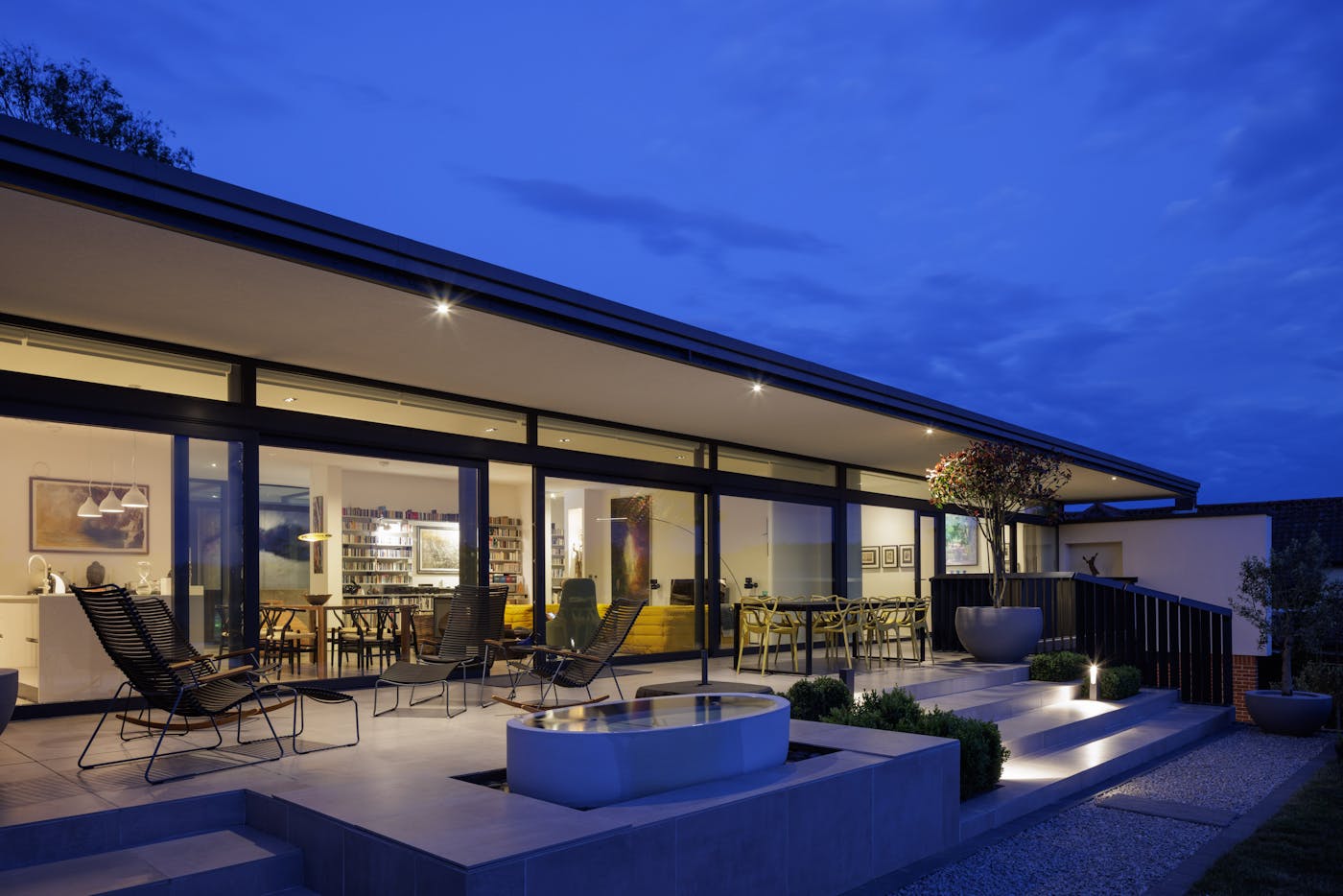 And as night falls, the wide use of glazing throughout lights up from the inside and creates the perfect outside spot to wind down