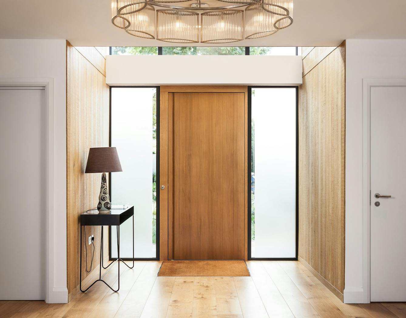 This front door features two glass side panels (side lights)