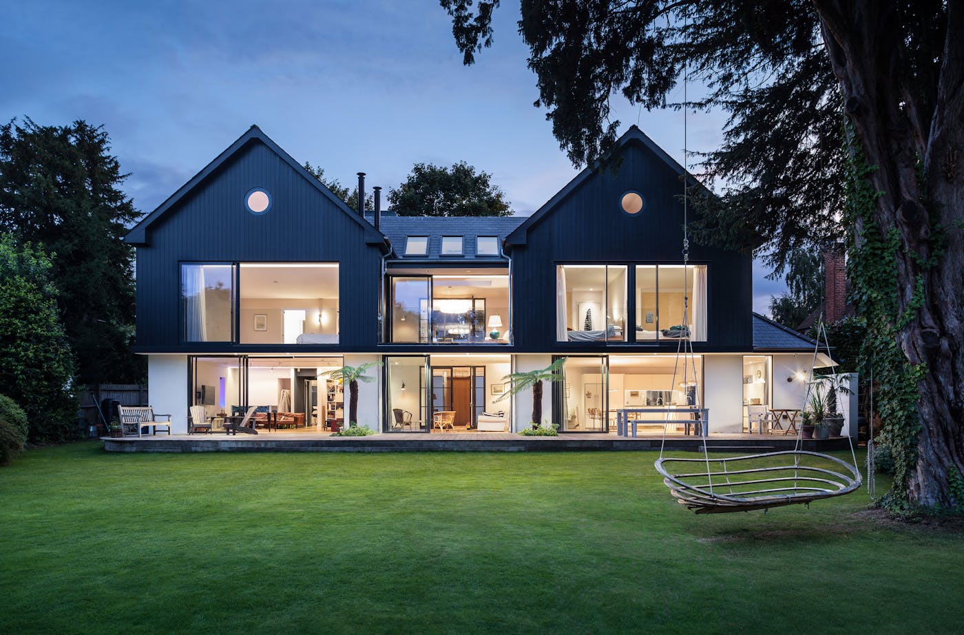 The rear view of the house shows how a wall of glass can light up the interior