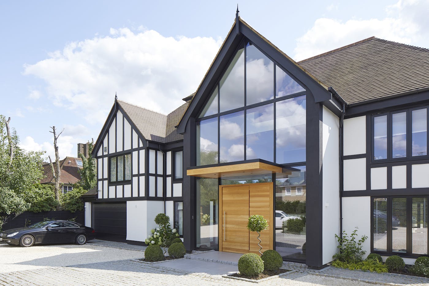 Traditional property with a parma e98 flush pivot door in european oak