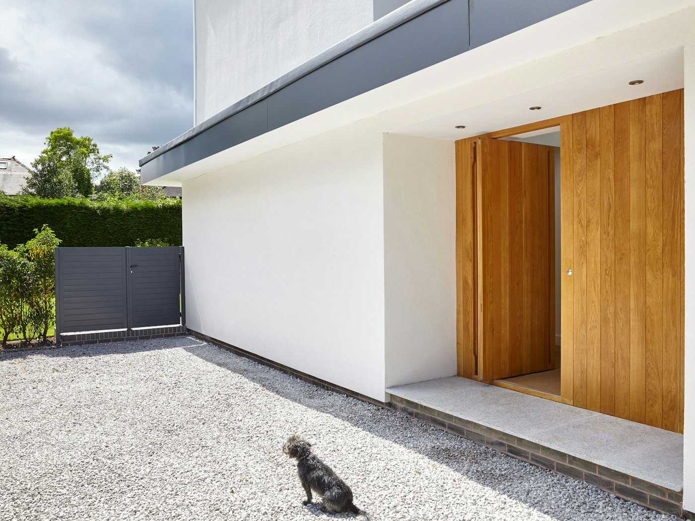 The additional wood side panel gives the impression of a larger entrance