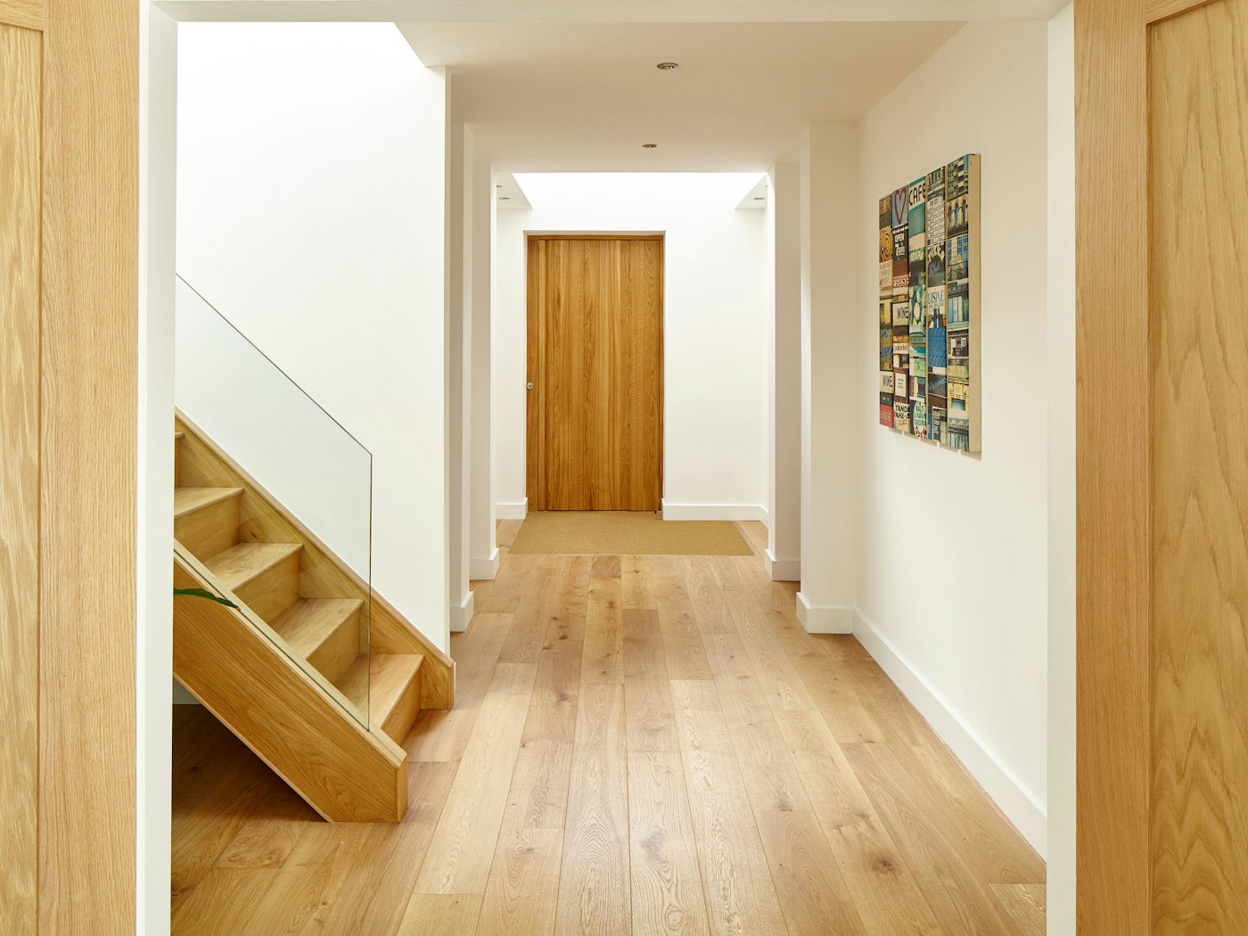 Inside, the european oak theme flows throughout this minimalist house