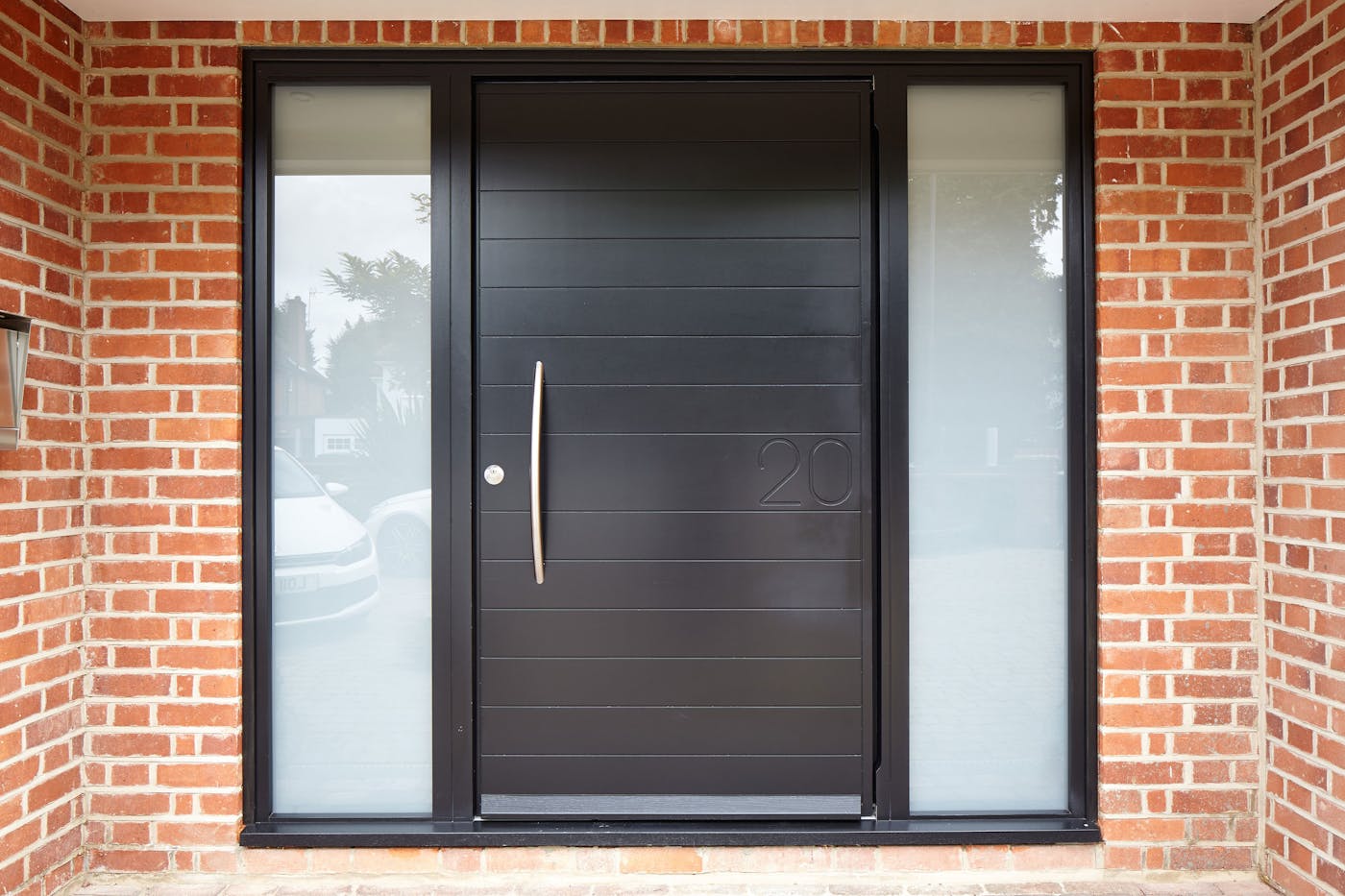 The Numero door design features the house number