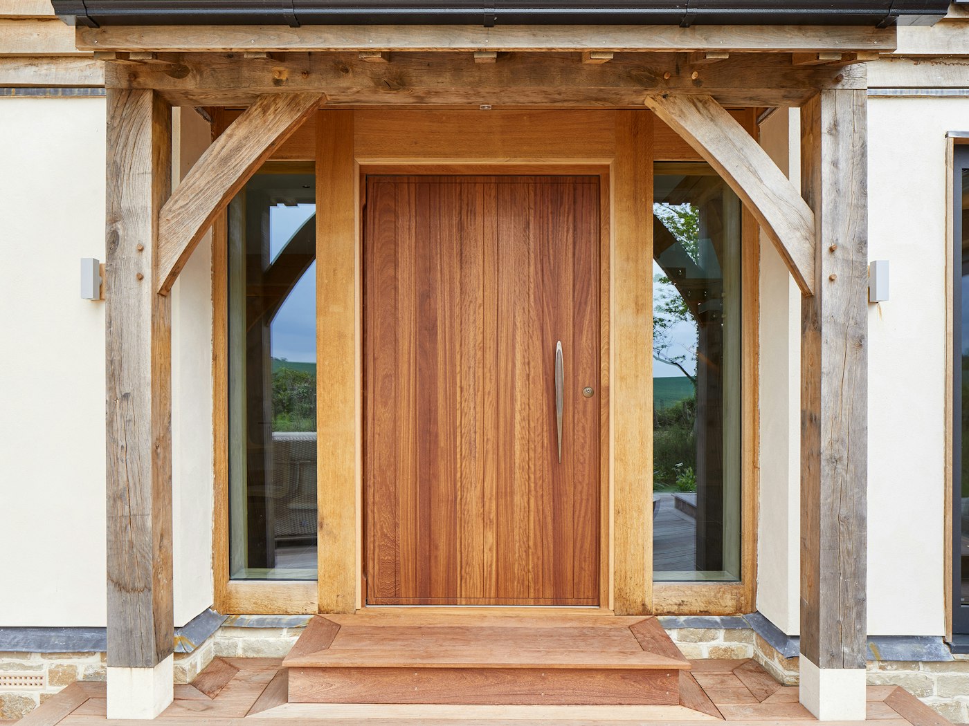 The traditional oak frame contrasts beautifully with the contemporary front door