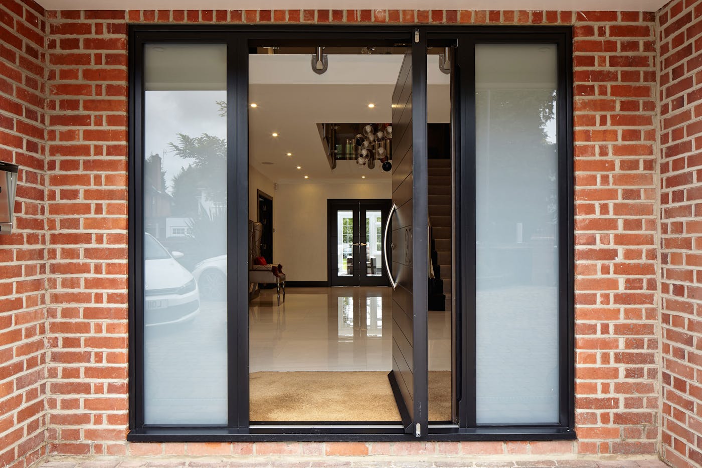 Sandblasted glass side panels add extra interest