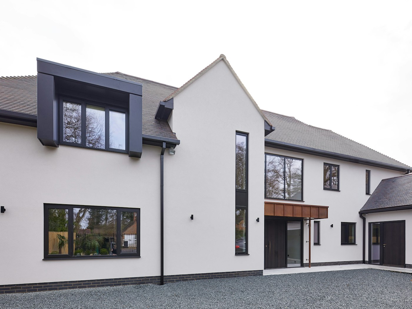 Contemporary house with Rondo V front door in Fumed Oak