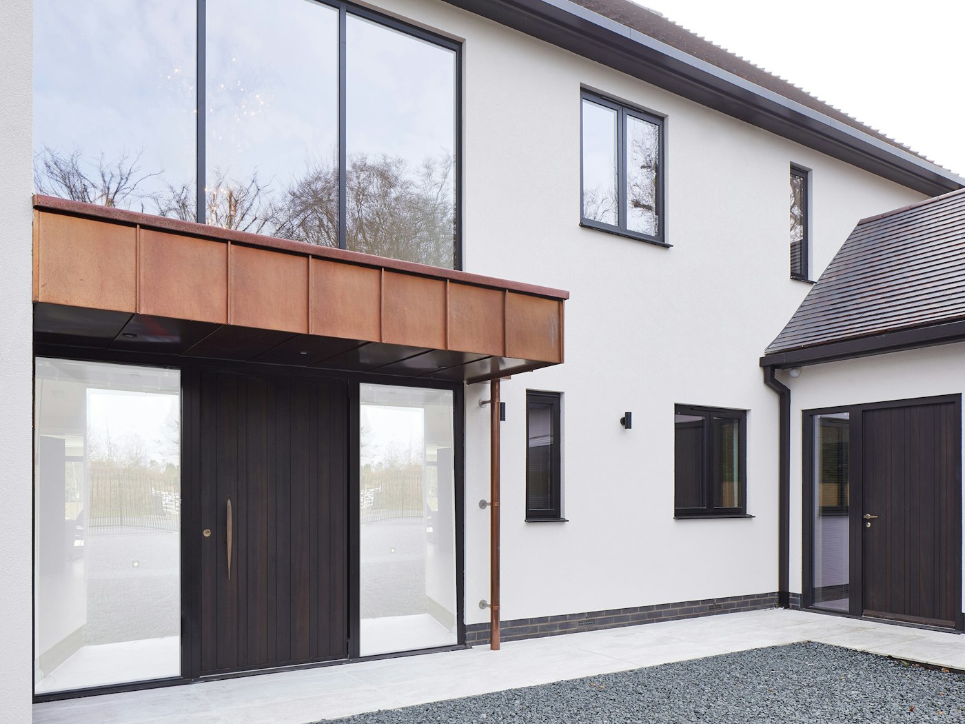   The house features two of our E80 doorsets one as a pivot and one as a side door in a hinged version
