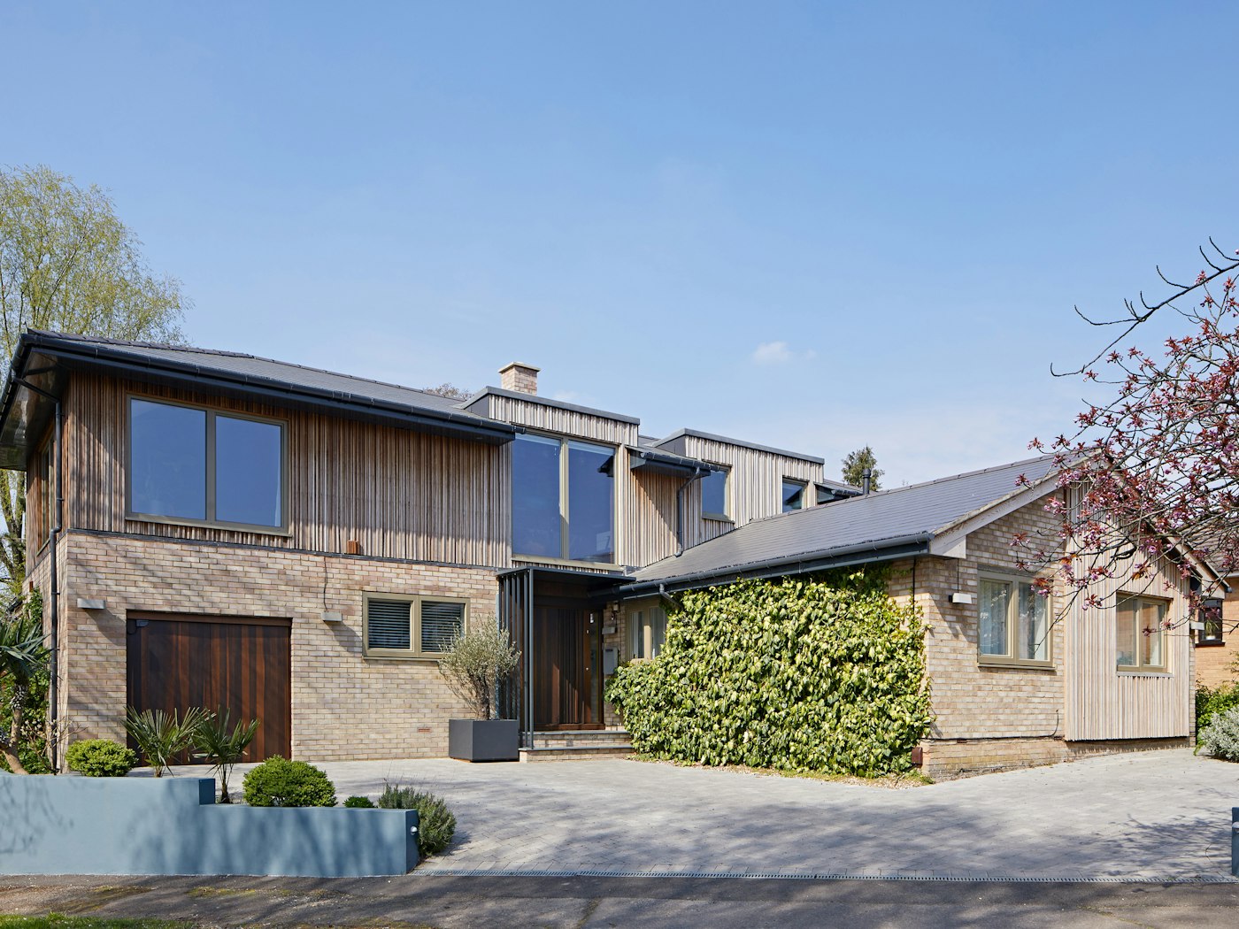 A traditional 1970's bungalow gets a contemporary makeover with a whole new upper floor