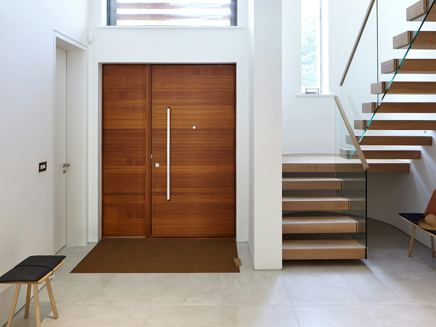 The contemporary front door is matched by the modern interior