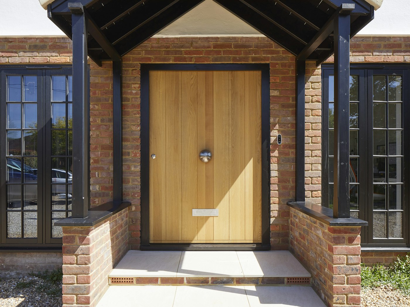 A black frame highlights the standout dimensions of this big entrance door