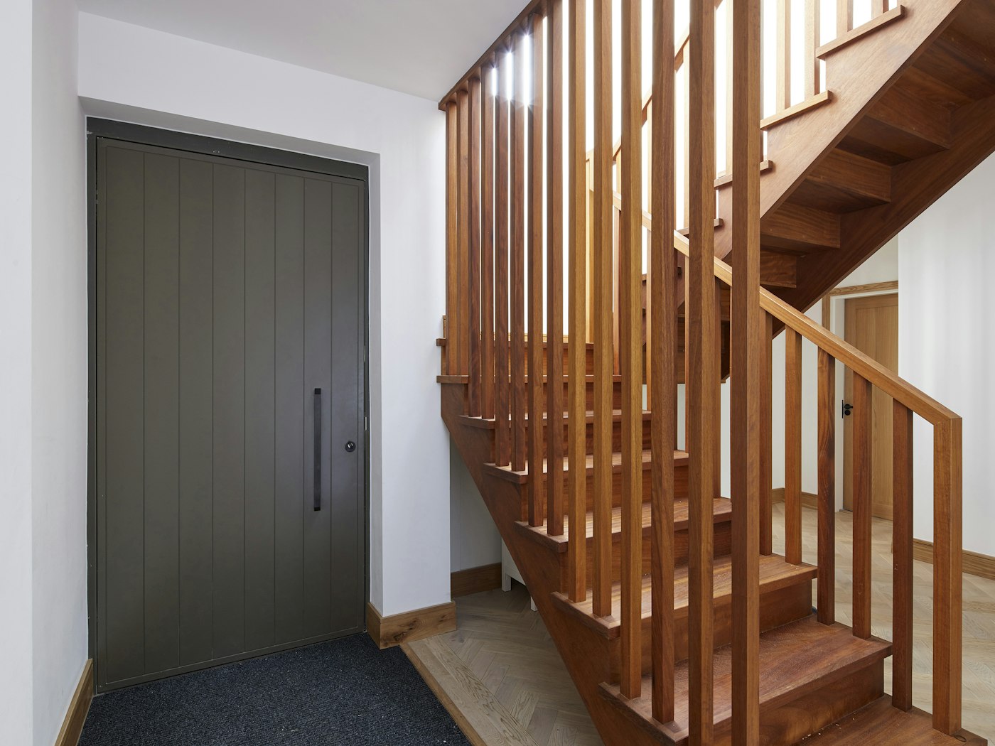 Internally the olive colour perfectly complements the wooden staircase