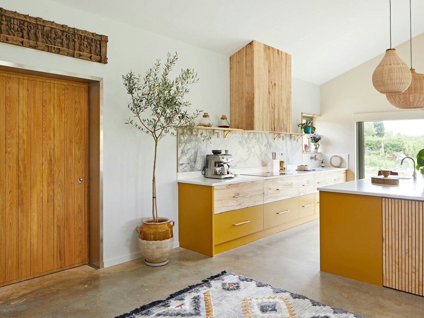 Internally, the door complements the stunning, handcrafted bespoke kitchen
