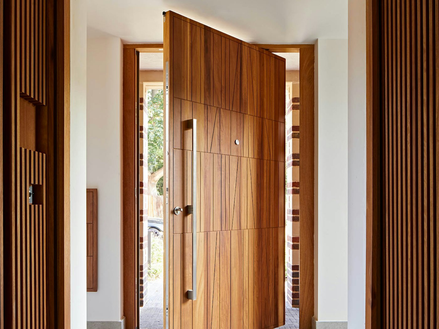 Our uniquely intricate Quattro design, in luxury iroko with a pivot opening