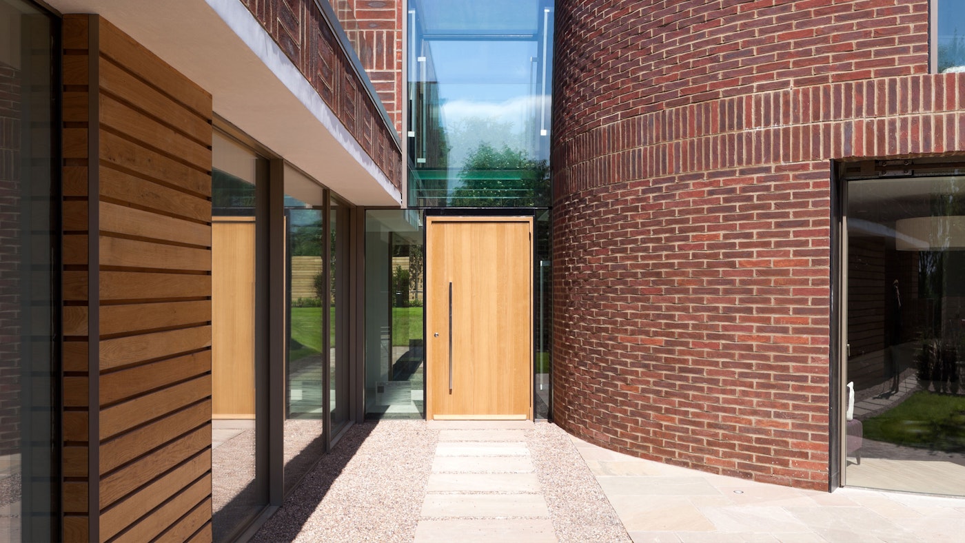A contemporary oak front door in a uniquely designed house