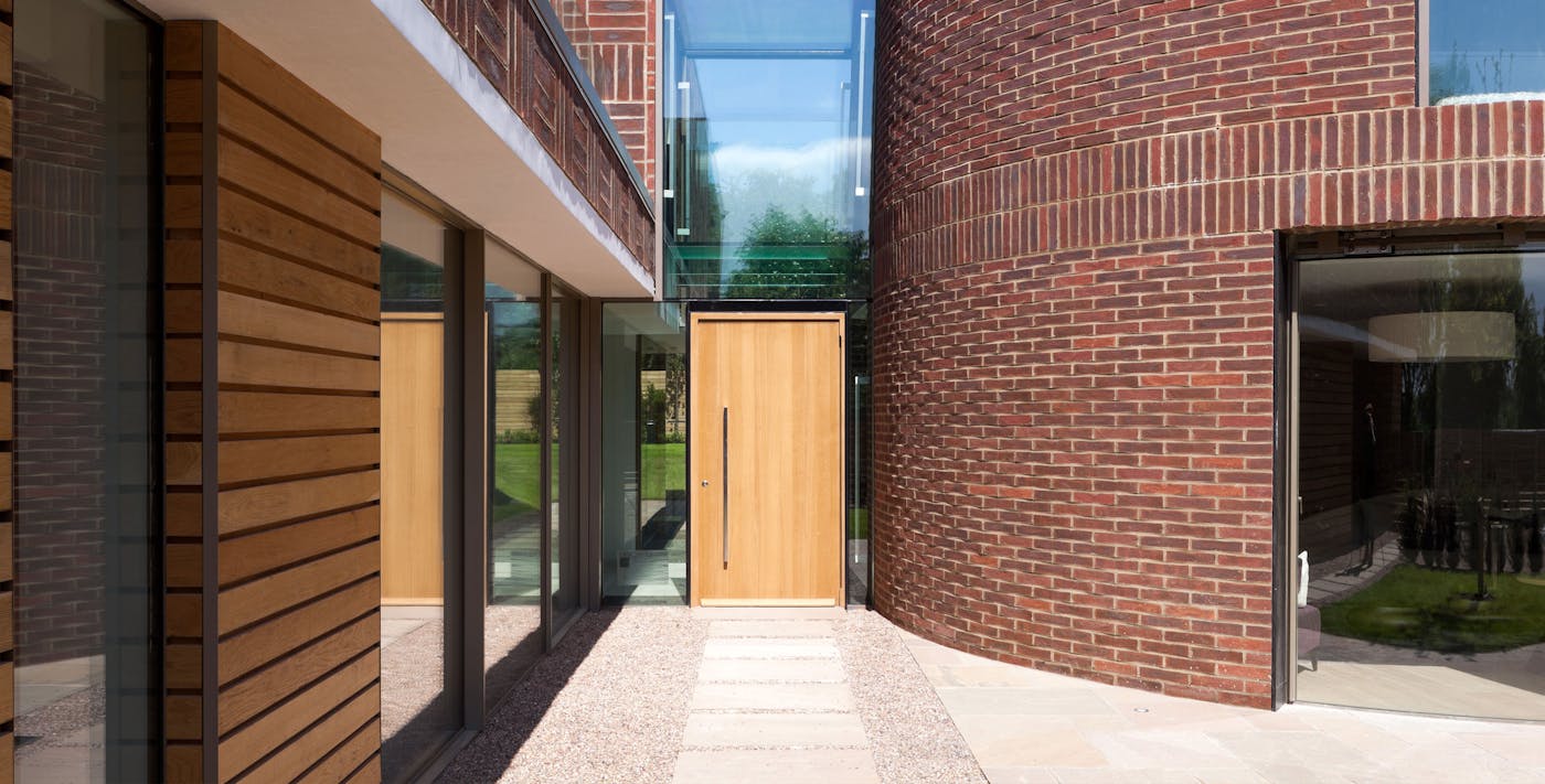 A contemporary oak front door in a uniquely designed house