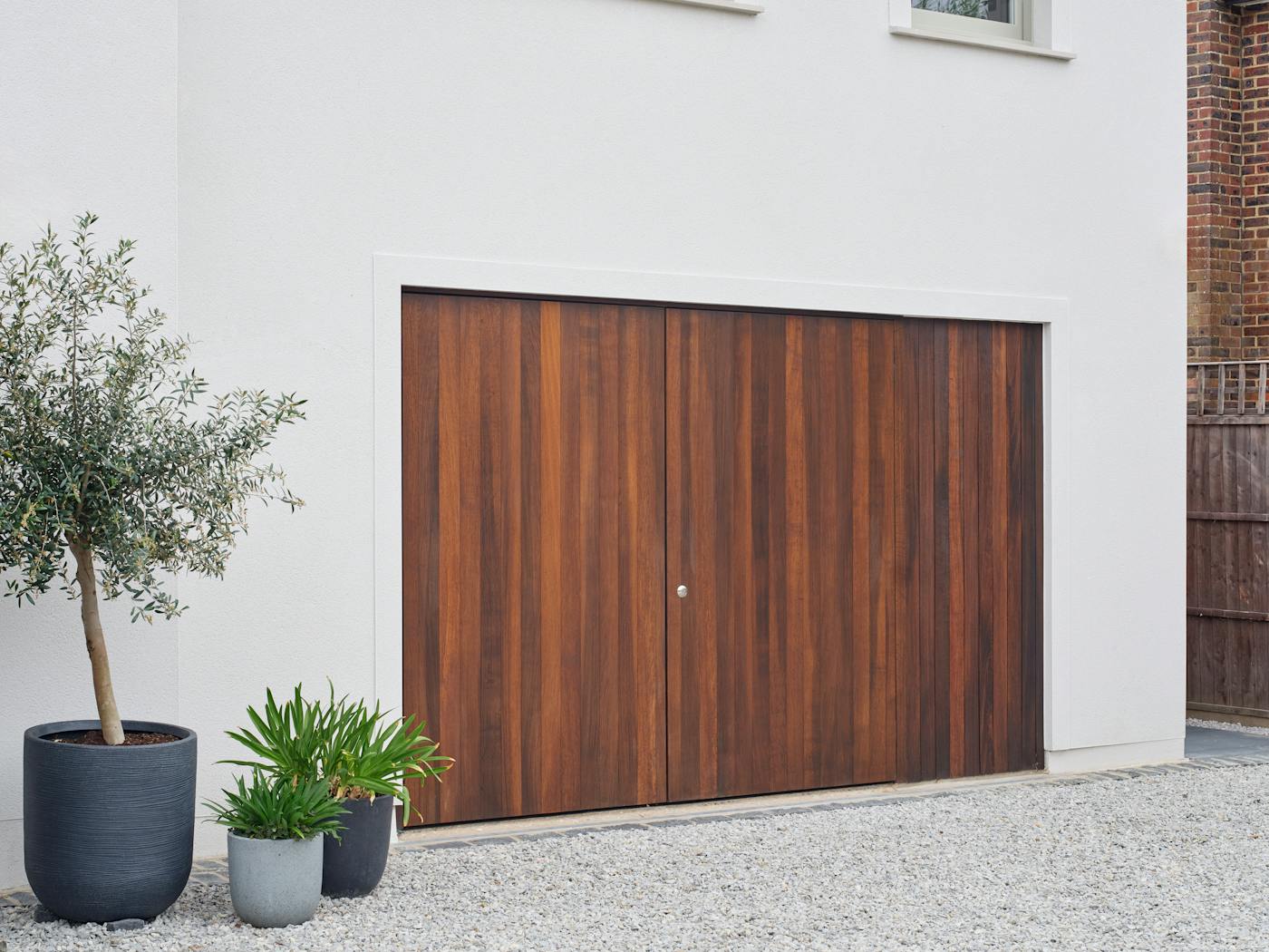 Side hung garage door plus cladding in fumed oak