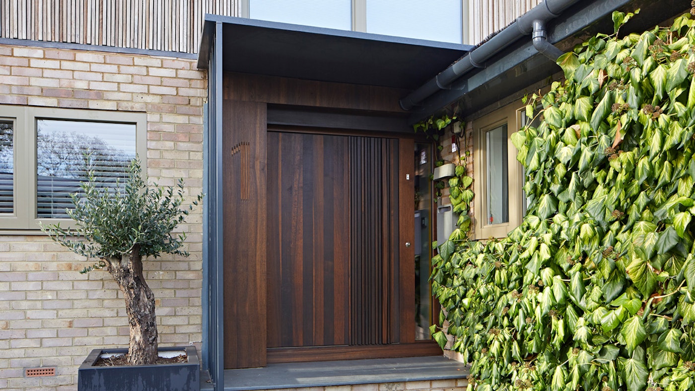 One of our newest designs and already a bestseller, here's our Bari front door (featuring raised elements) in stunning fumed oak with a unique wooden handle