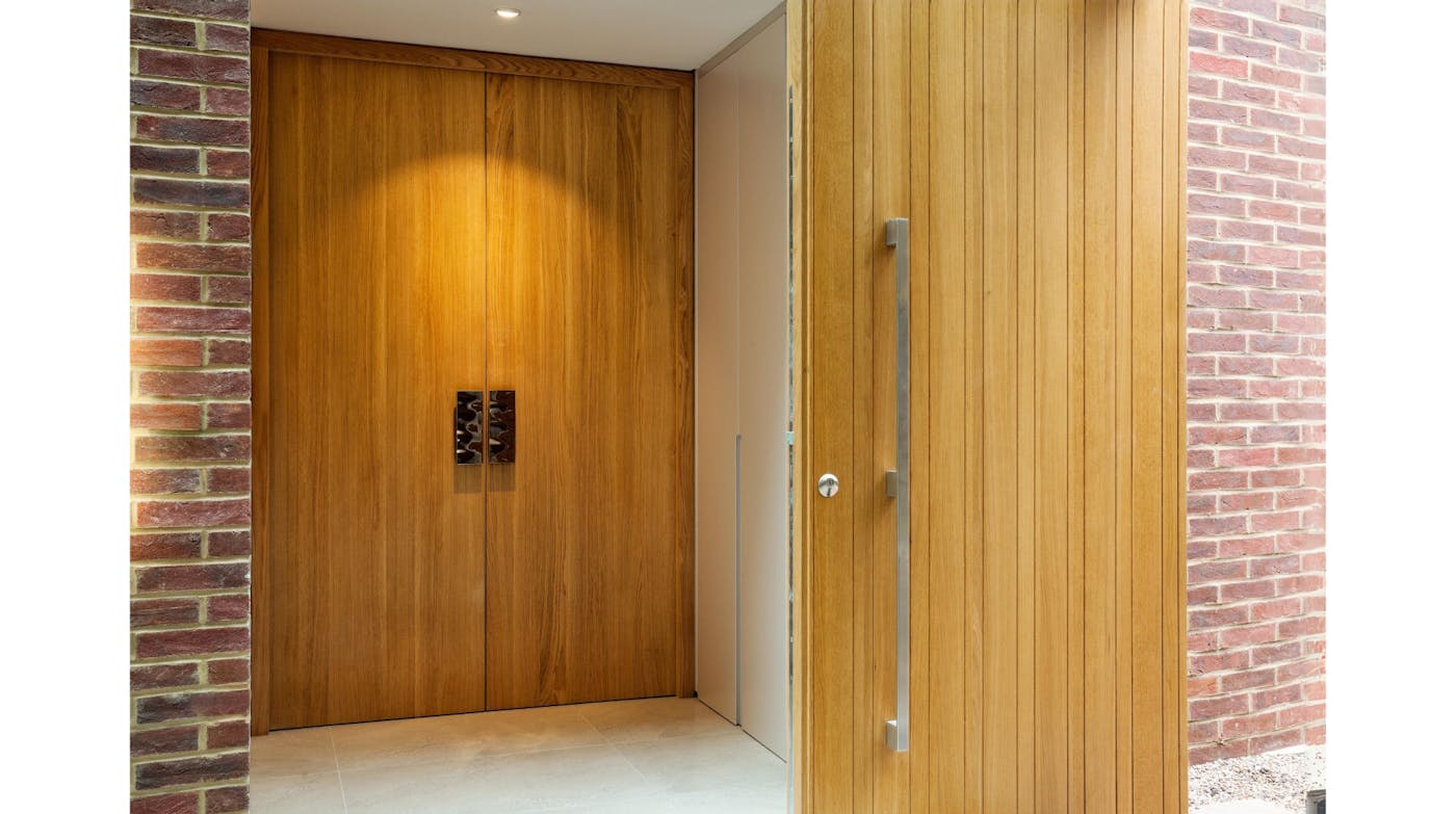 Double internal doorset in a Raw design with Rondo V  front door in iroko