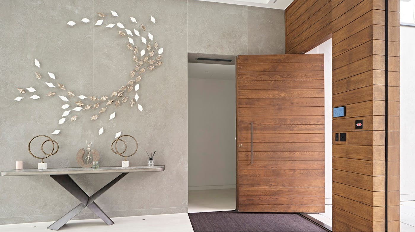 Parma pivot door in oak. Oiled onsite by customer to match cladding