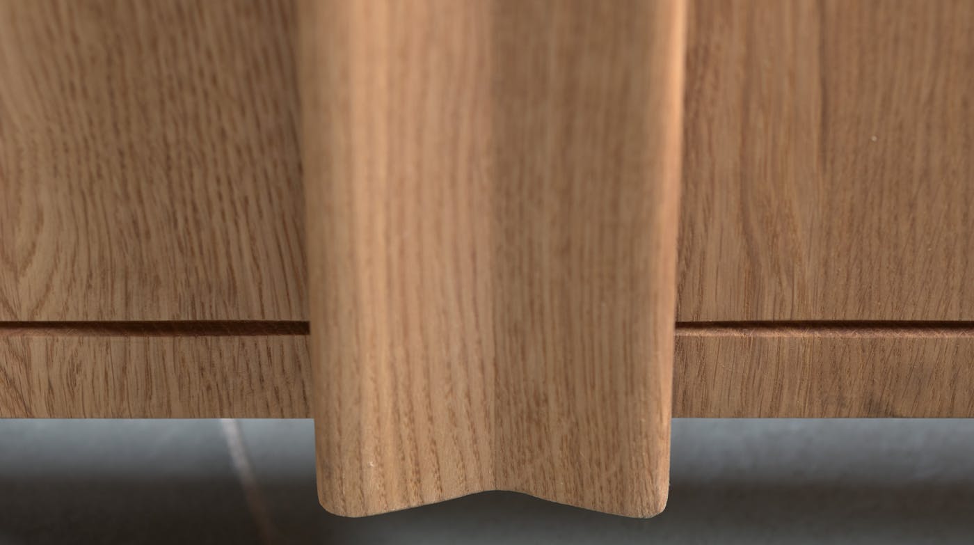 The curved handle in a bow shape is the length of the door