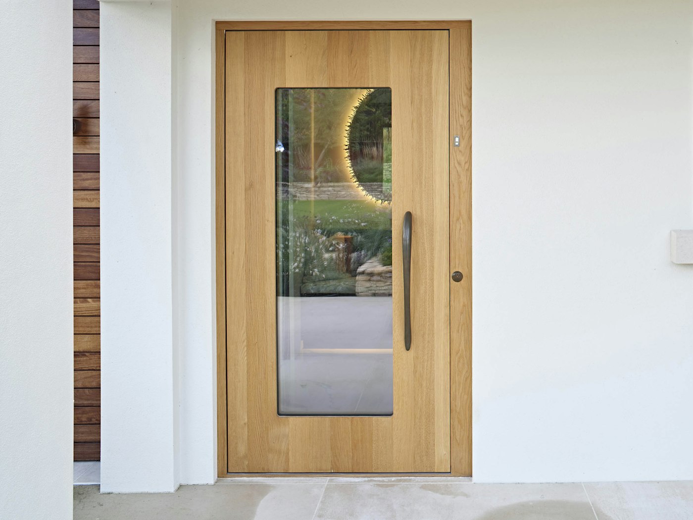 The Ice V in European oak, features a large, uninterrupted glazed panel