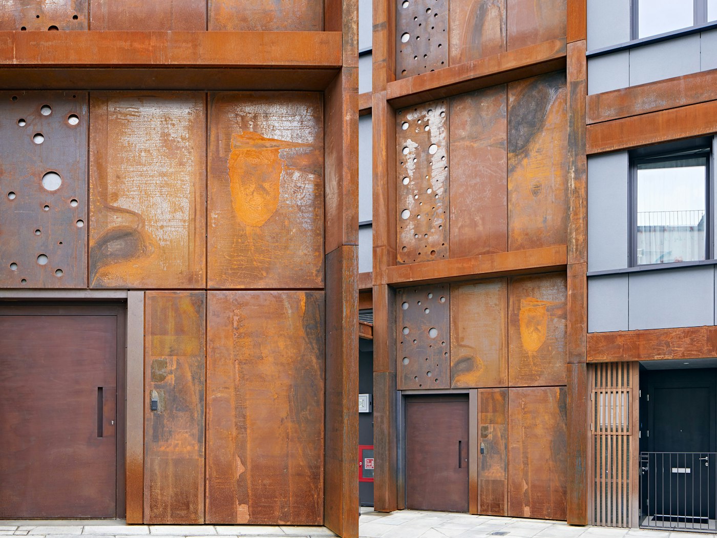 This large steel door fits perfectly with the mixed industrial aesthetic of the building