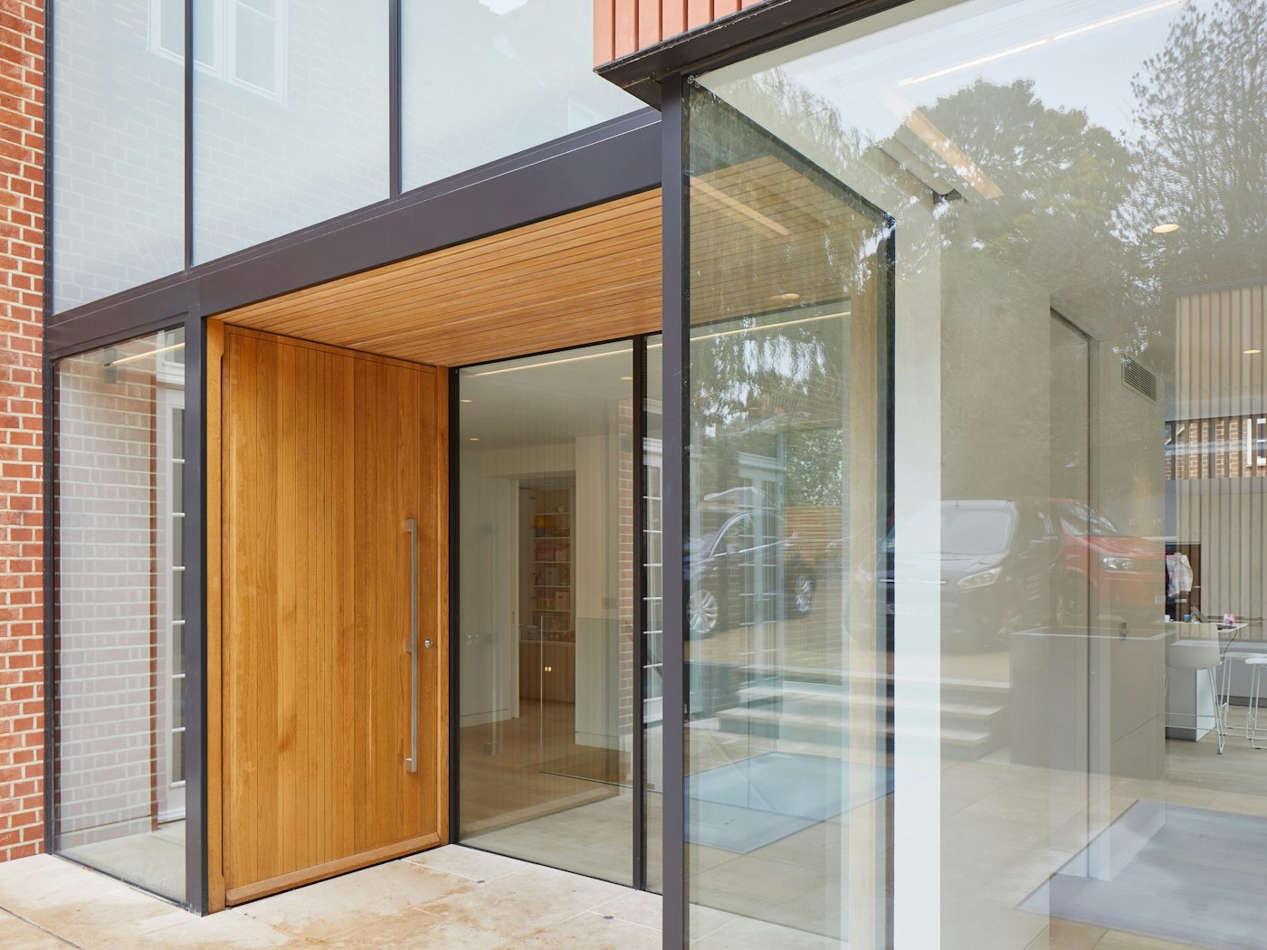 The unusual placement of the door in the facade also adds to the contemporary style
