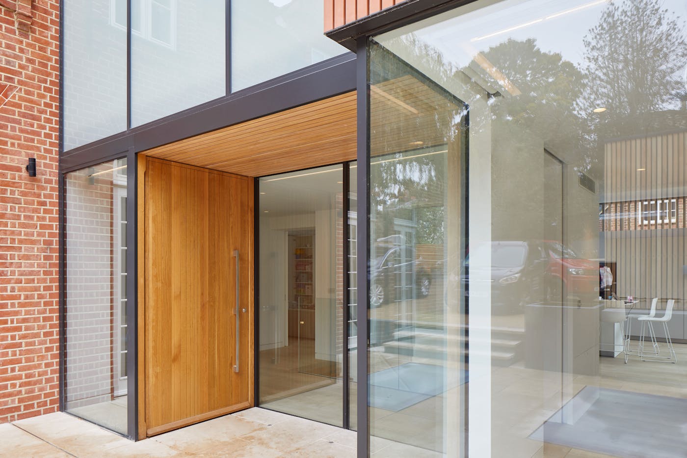 The unusual placement of the door in the facade also adds to the contemporary style
