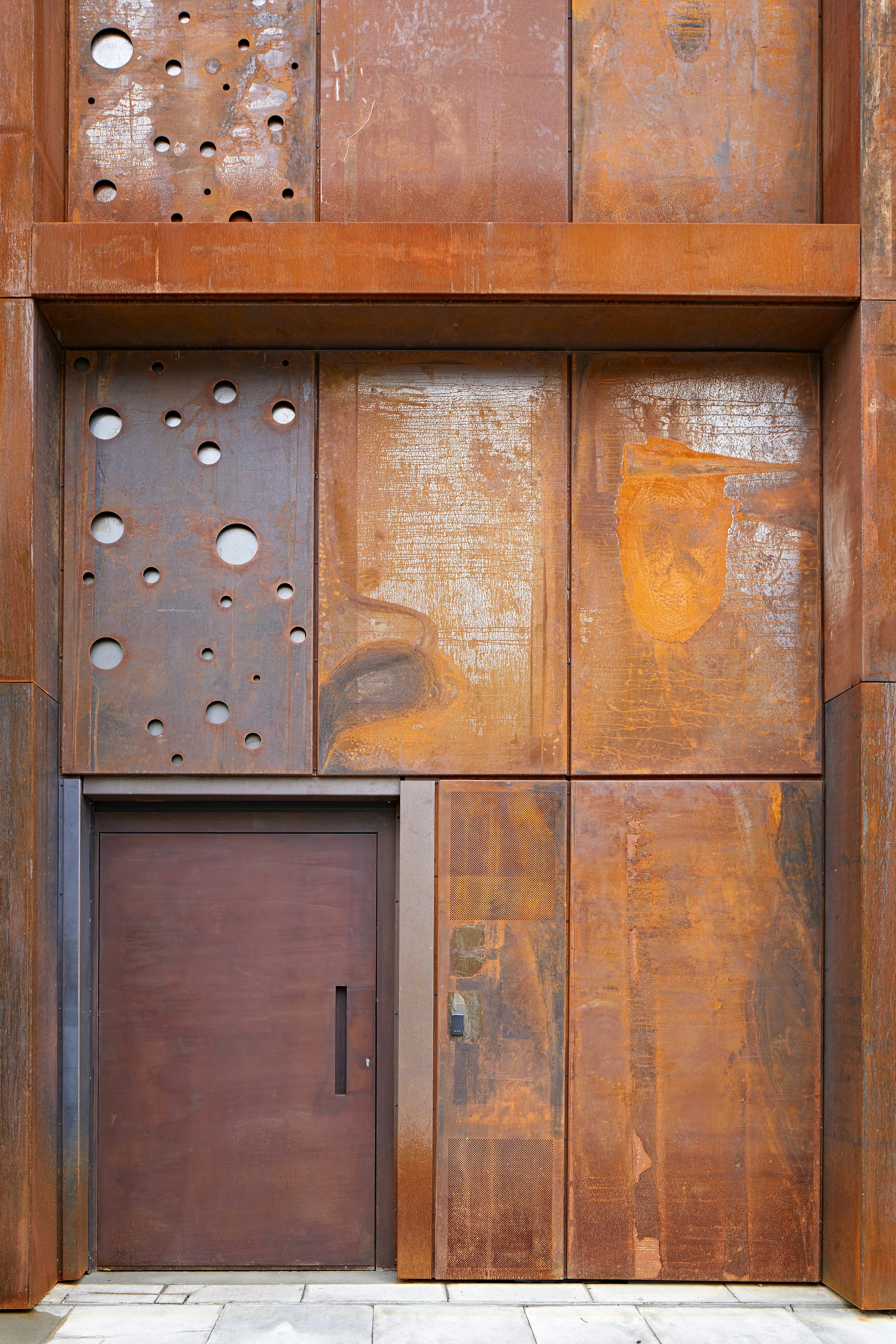 raw steel door in a corten rust finish 