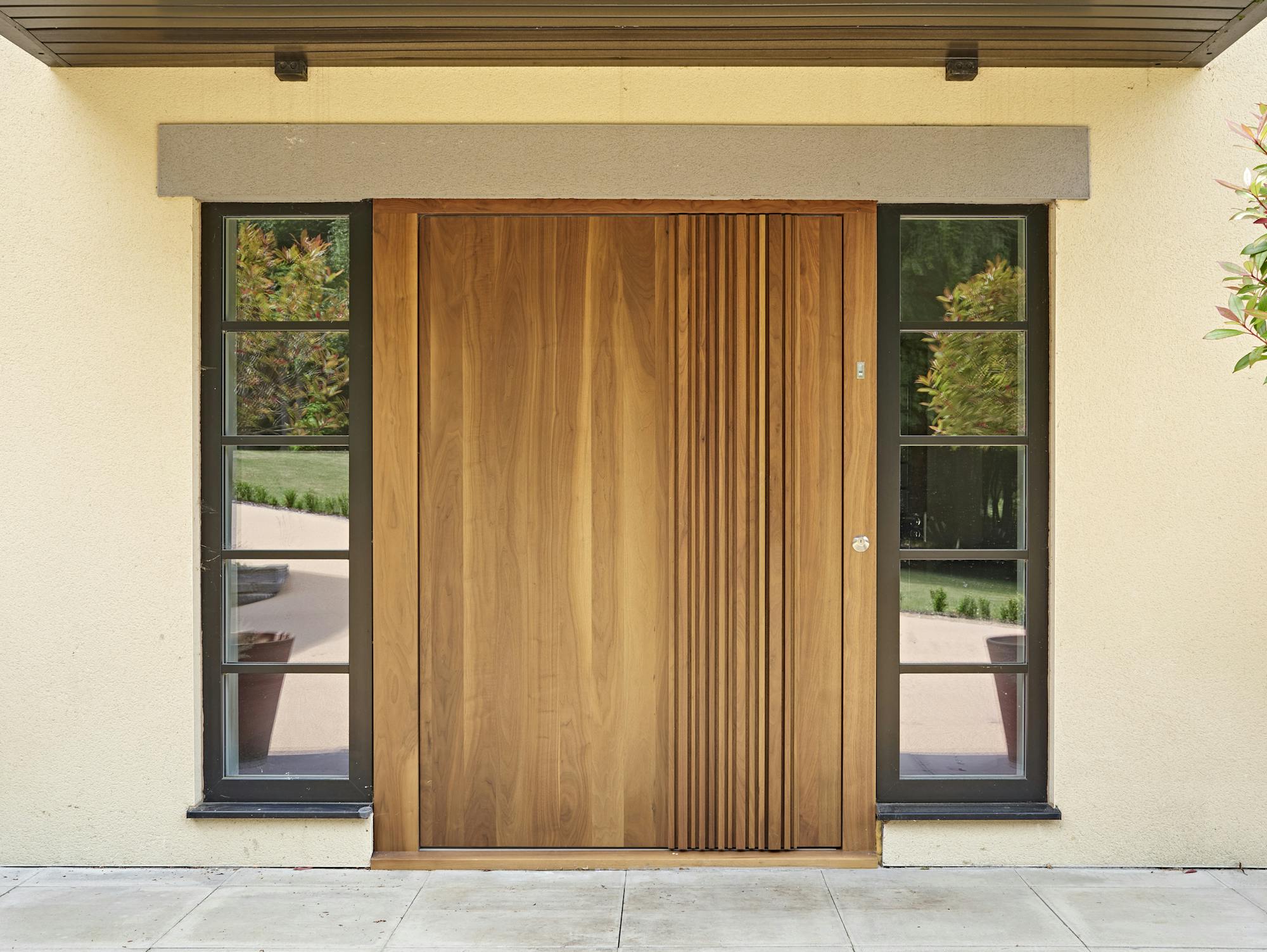 Bari Pivot door design in Walnut with Bari Handle